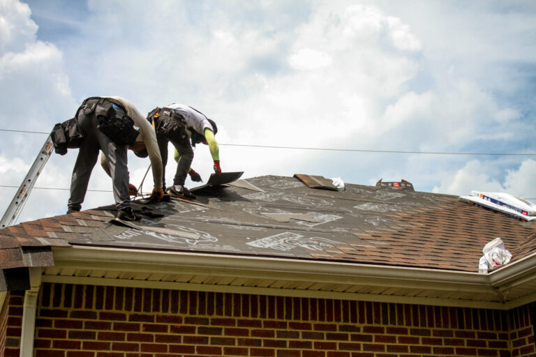 Roofers working on the new roof.