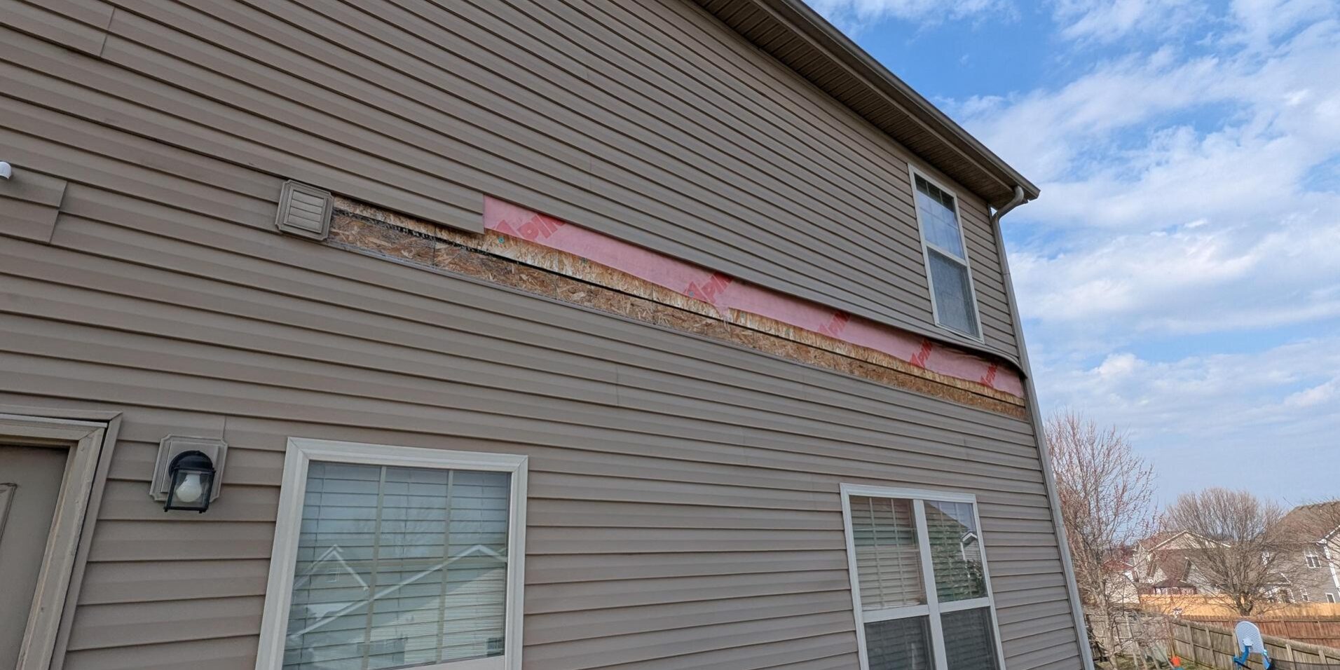 damaged siding, not up to current building codes