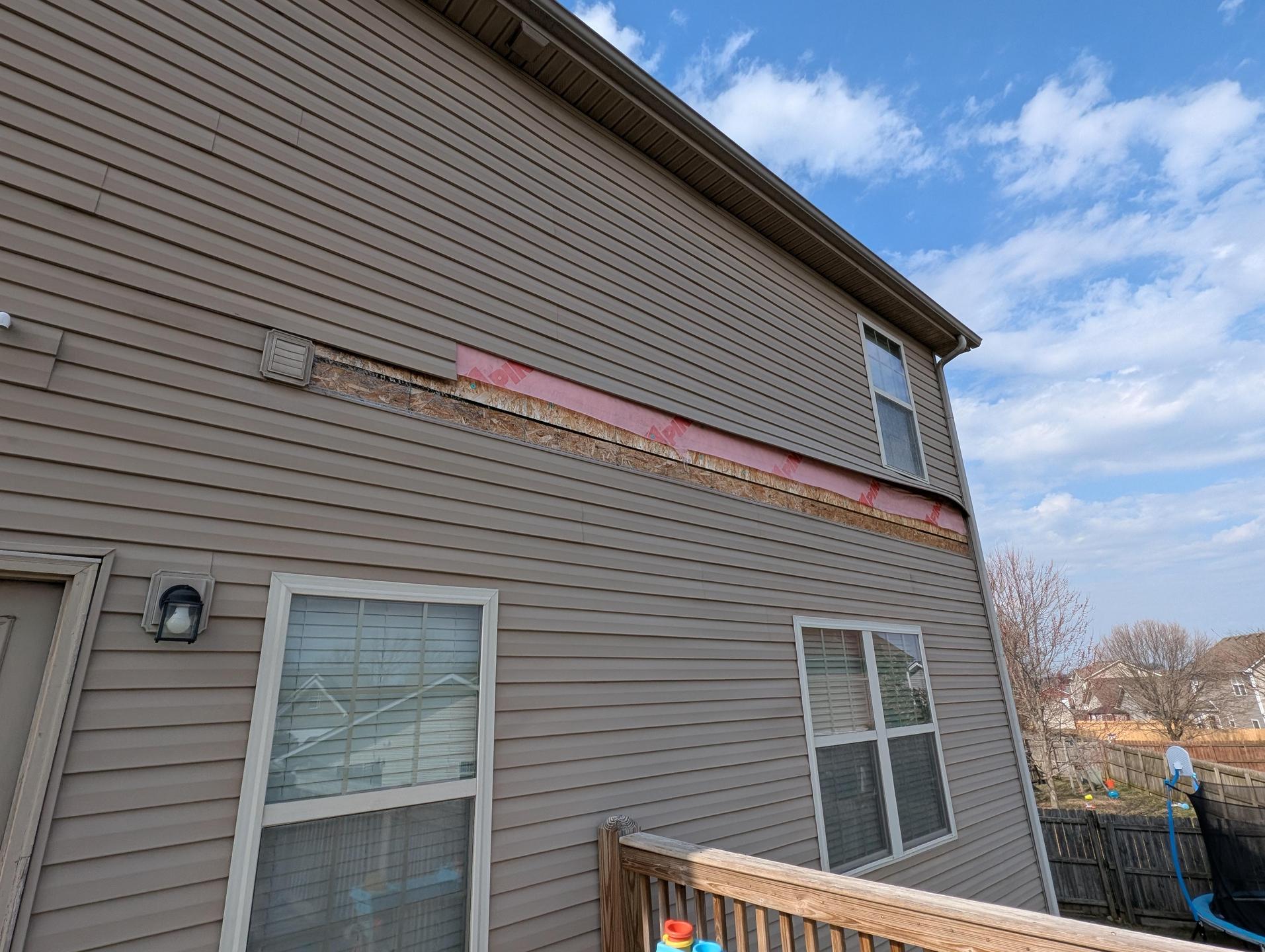 damaged siding, not up to current building codes