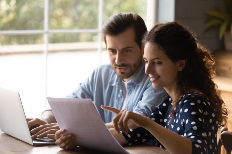 couple reading paperwork